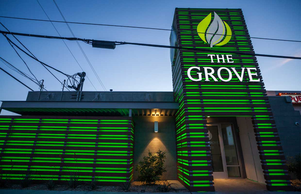 Bright green lights and a tall entrance welcomes in clients at The Grove dispensary in Las Vegas.