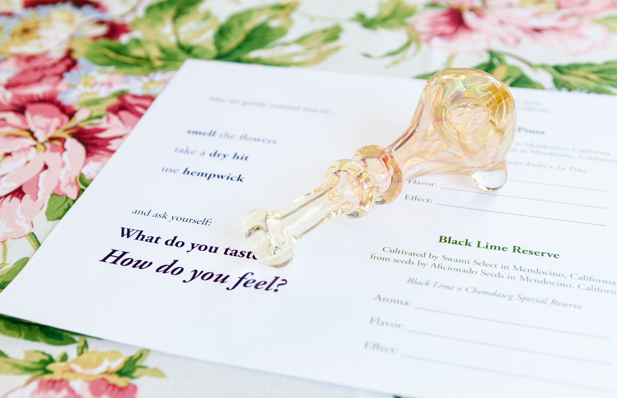 A clean sits atop a survey that will be filled out by the Flower Girls smoking society.