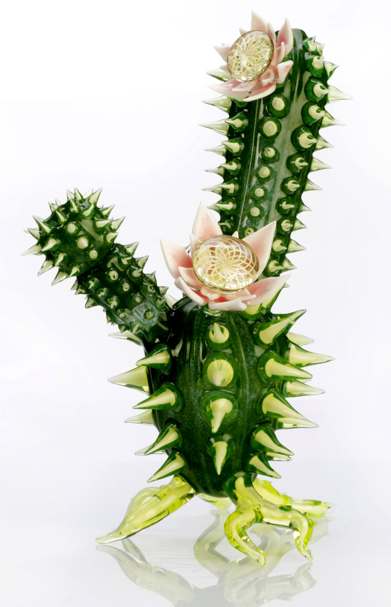 A small glass piece with realistic spikes portrays a realistic cactus, yet the piece is a functioning water pipe.