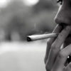 woman smoking cannabis joint outside