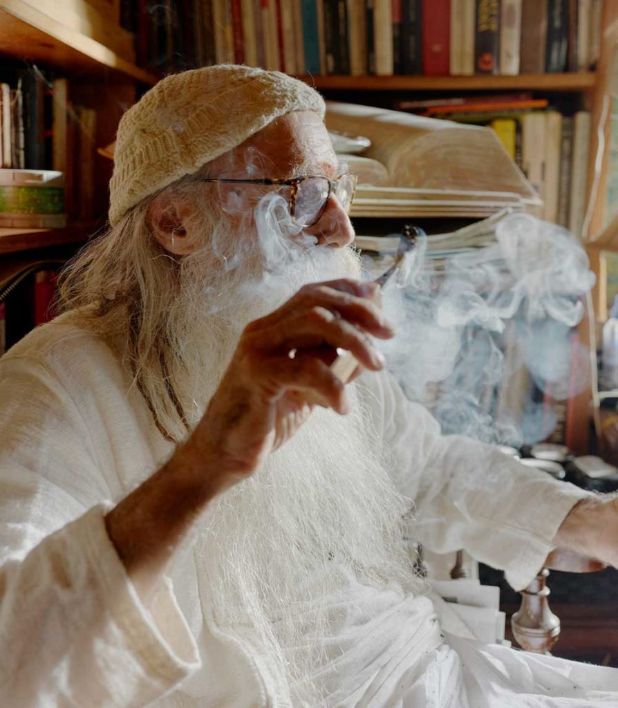 Swami enjoying a joint of Vintage Cannabis