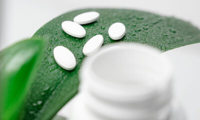 pills with green background leaf